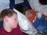 Roy and Ian sleeping on the plane