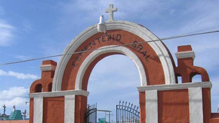 A gated archway with the words